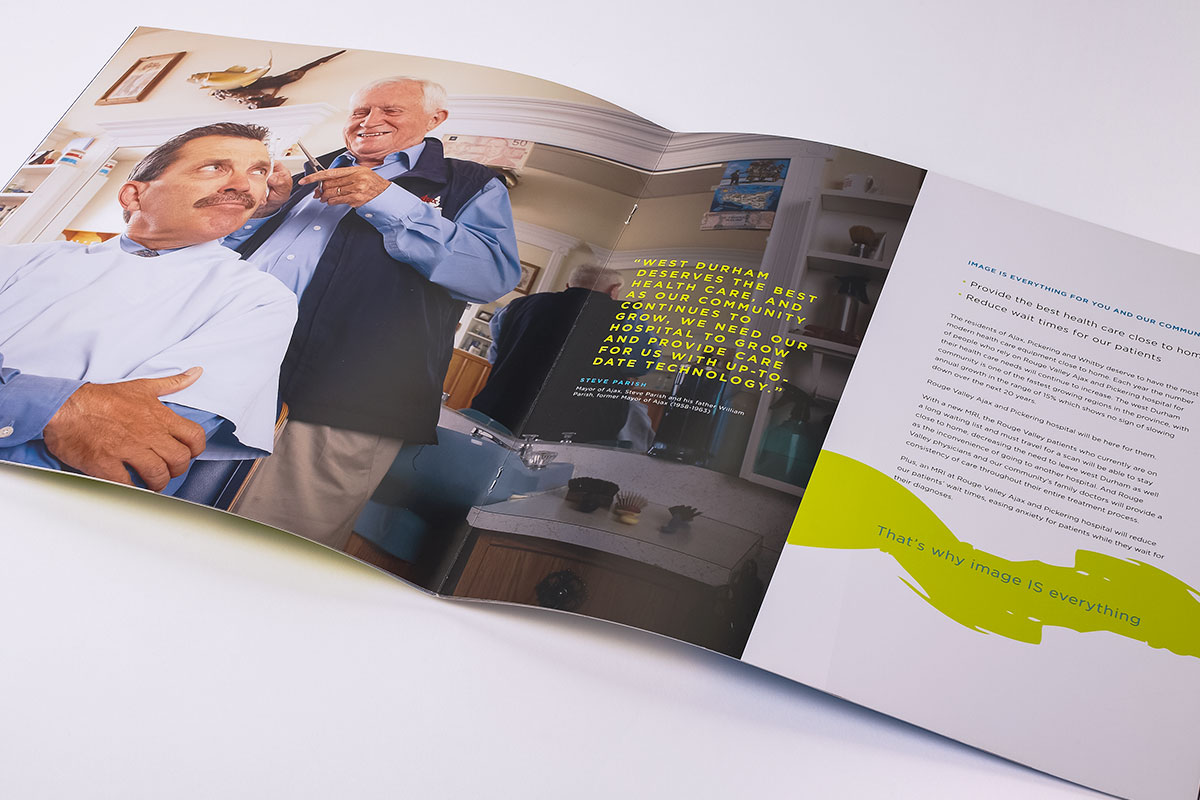 Case for support spread featuring the Mayor of Ajax getting a haircut by the former Mayor of Ajax, who is also his father